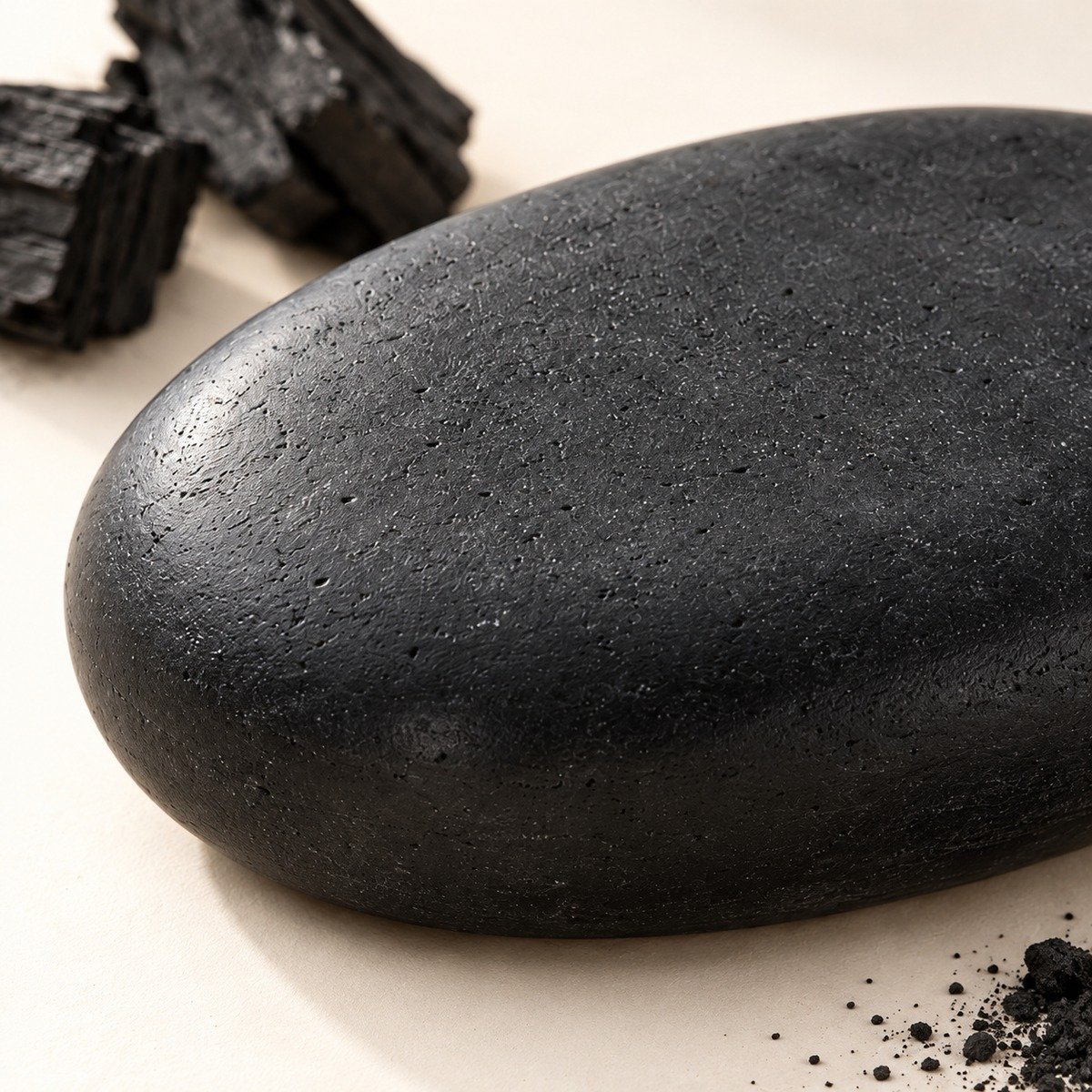 Close-up of the black charcoal soap surface and rounded edge